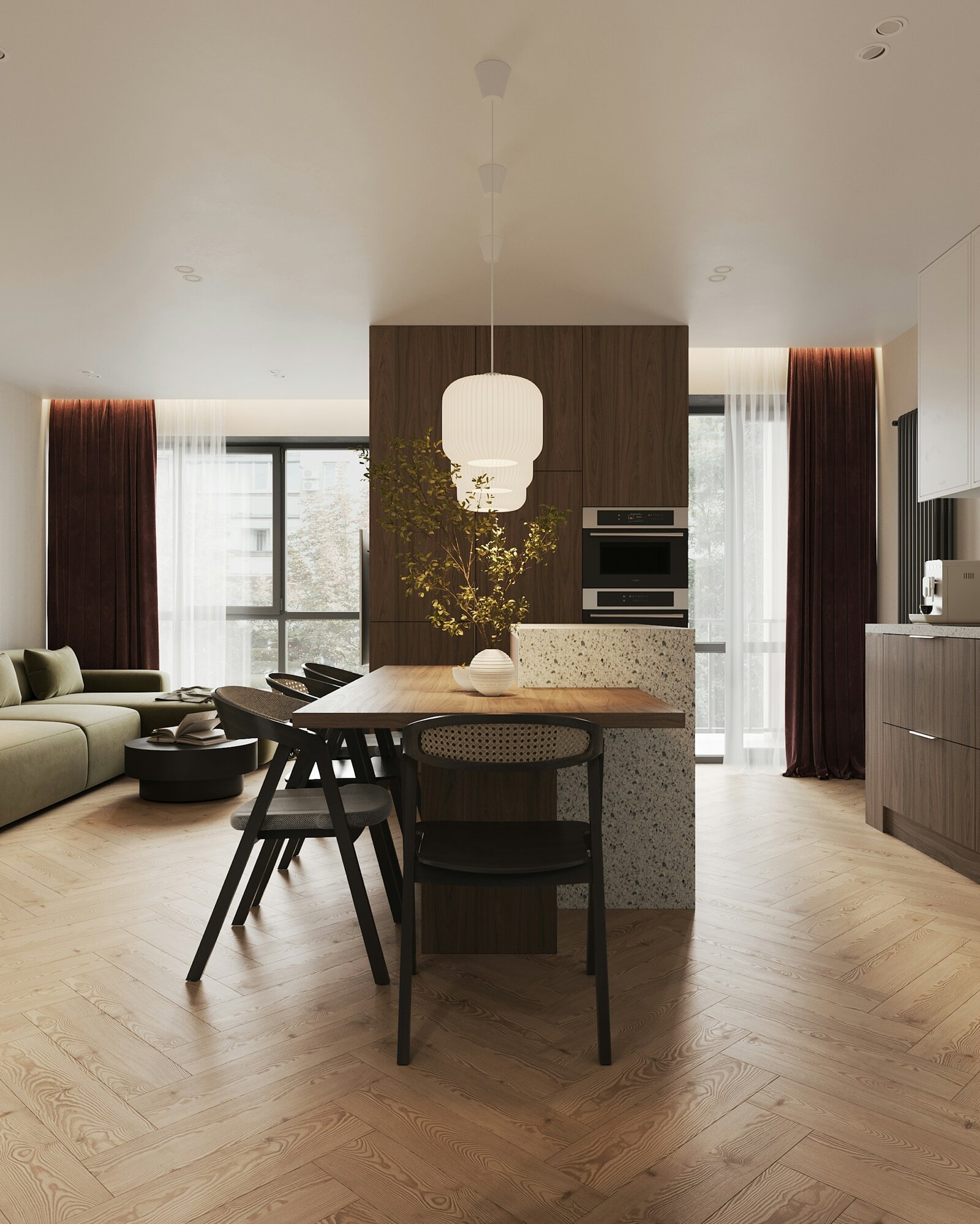 Modern open-plan kitchen and dining space with herringbone floors and pendant lighting.